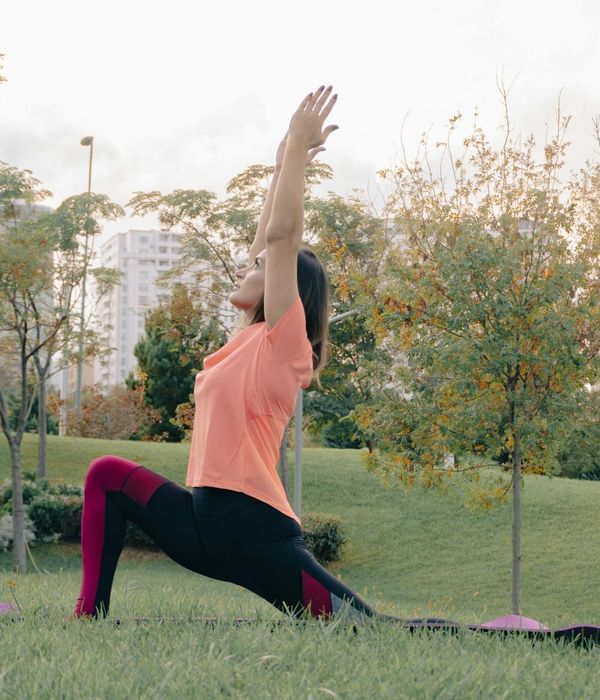 Woman performing a calm yoga pose, embodying balance and control.